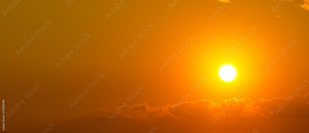 Orange sunrise in sky.