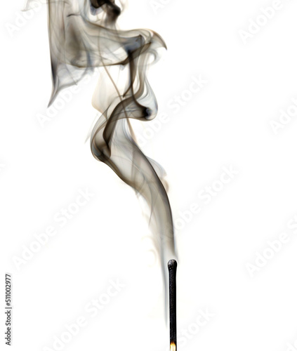 Match with smoke. Smoke coming from a half-burnt match on a white background close-up.