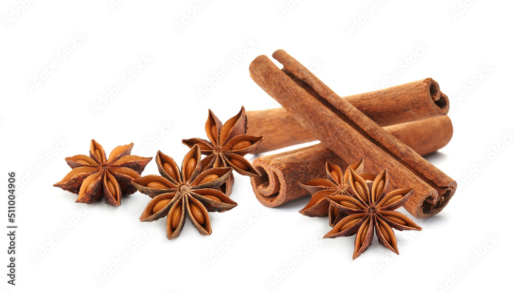 Aromatic cinnamon sticks and anise stars with seeds on white background Aromatic cinnamon sticks and anise stars with seeds on white background