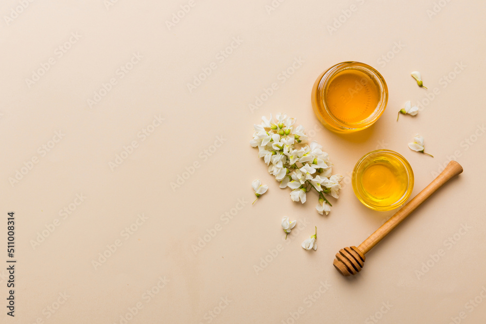 honey jar with acacia flowers and leaves. fresh honey top view flat lay honey jar with acacia flowers and leaves. fresh honey top view flat lay