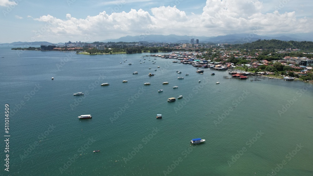 Kota Kinabalu, Sabah Malaysia – June 15, 2022: The Tanjung Aru Beach, Fisherman Village and Shangri-La Hotel