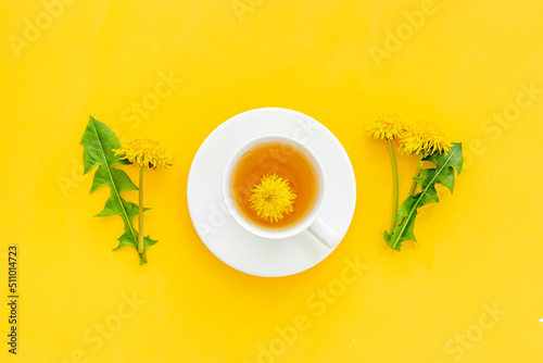 Herbal tea with meadow yellow dandelions blossoms and leaves