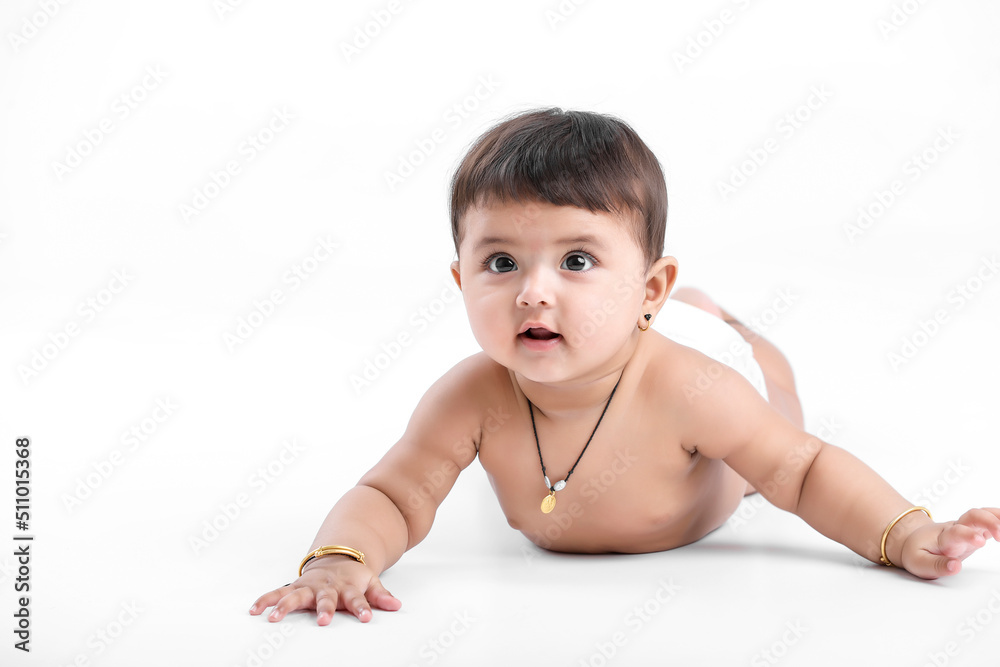 Indian baby girl playing on white background. Indian baby girl playing on white background.
