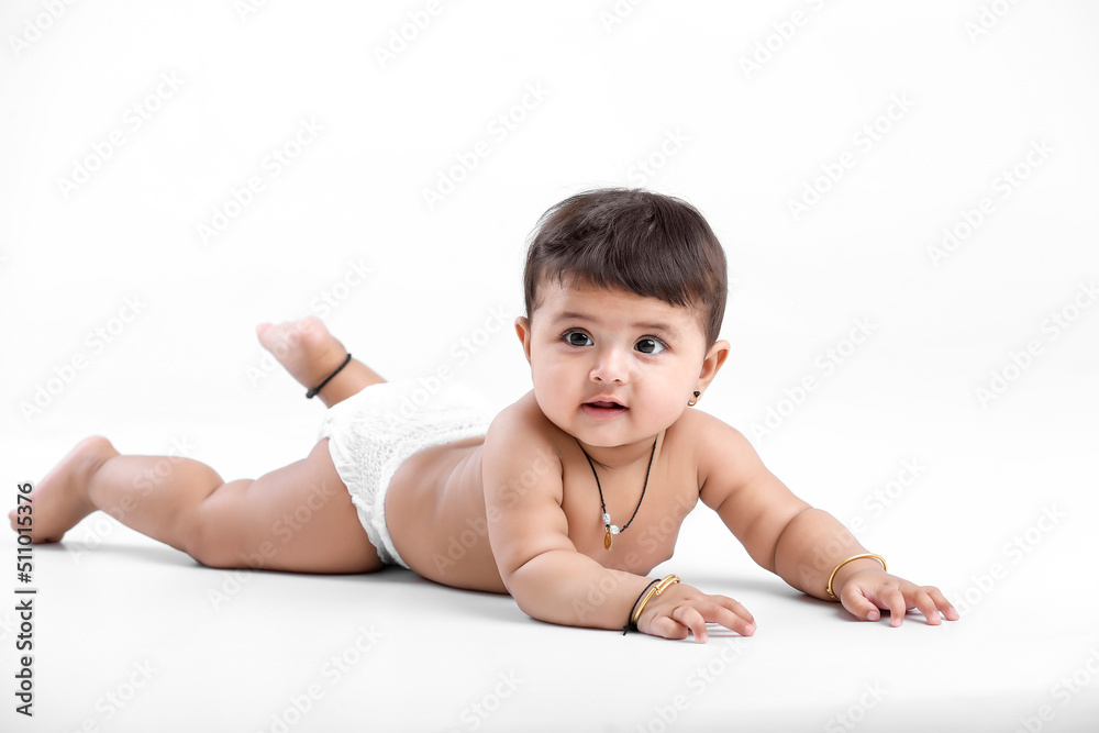 Indian baby girl playing on white background. Indian baby girl playing on white background.