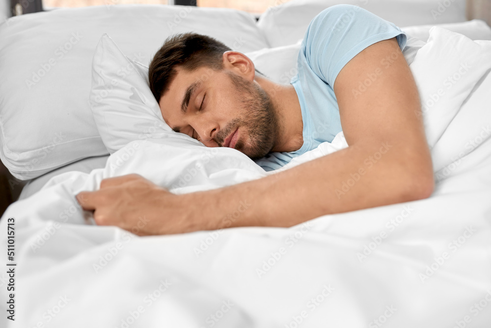 people, bedtime and rest concept - man sleeping in bed at home people, bedtime and rest concept - man sleeping in bed at home