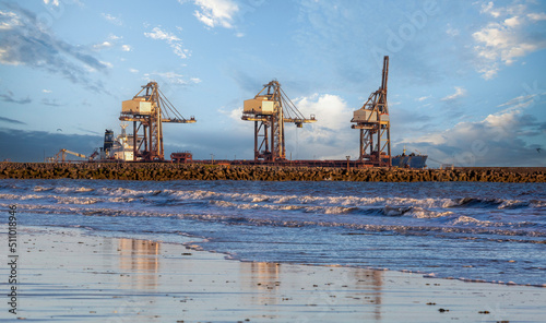 Cranes and breakwater photo