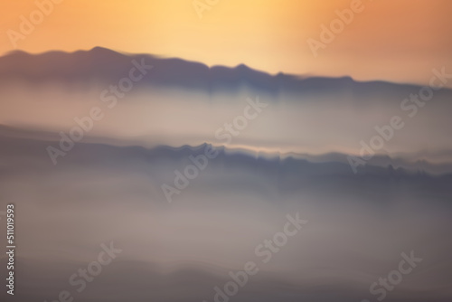 Sunset or sunrise above the mountains, nature landscape background, horizontal panorama of beautiful sunrise in the mountains.