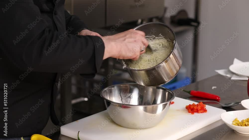 chef preparing tasty food on kitchen table chef preparing tasty food on kitchen table
