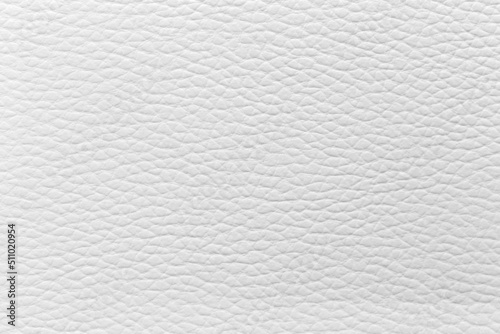 The white leather texture is used as a luxury classic background.