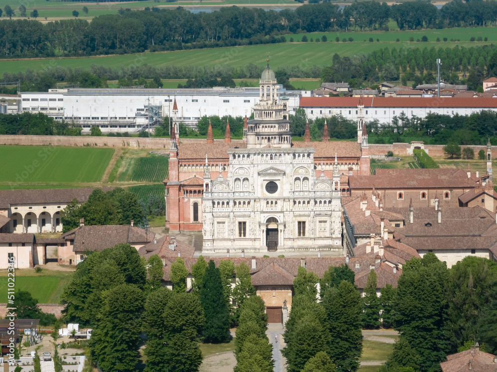 Aerial view of the Certosa di Pavia at sunny day, built in the late fourteenth century, courts and the cloister of the monastery and shrine in the province of Pavia, Lombardia, Italy