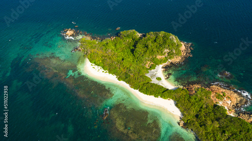 Pigeon Island with beautiful beach by turquoise water view from above. Sri Lanka.