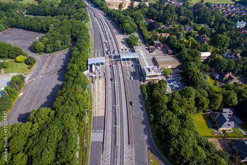aerial view of car and lorry drivers, paying at the toll booth on the north side to cross the Humber Bridge. Hessle. UK photo
