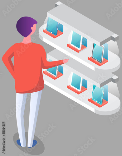 Man chooses smartphone at exhibition. Male character looking at mobile phones and tablets near promotion stand in shopping mall. Presentation of new technologies, gadgets, electronic devices at rack