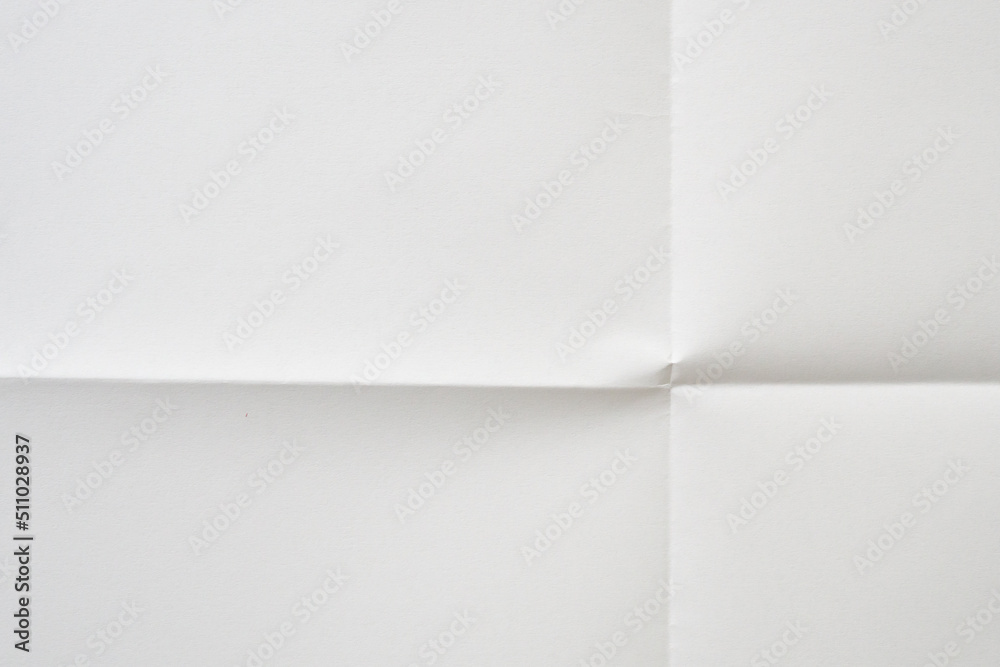 White folded and wrinkled paper texture background