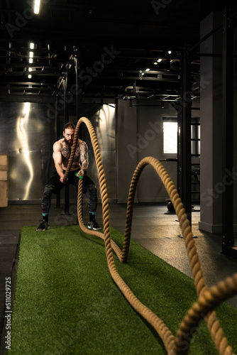 Rope man fitness gym beard training battle fit sport exercise, concept active equipment from physical from athletic activity, caucasian energy. Sportswoman people bodybuilding,