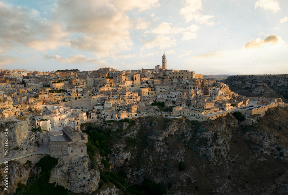 View from above, stunning aerial view of the Matera’s skyline during a beautiful sunrise. Matera is a city on a rocky outcrop in the region of Basilicata, in southern Italy.