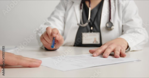 Doctor explaining examination results to patient, close-up. photo