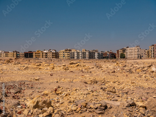 A city on the edge of a rocky desert. Desert landscape. photo