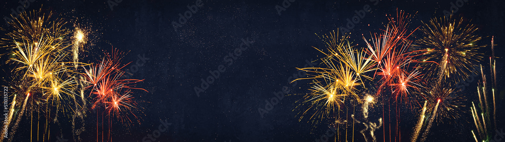 HAPPY NEW YEAR - Celebration New Year's Eve, Silvester 2023 holiday background panorama greeting card - Golden red firework fireworks pyrotechnics on dark night sky