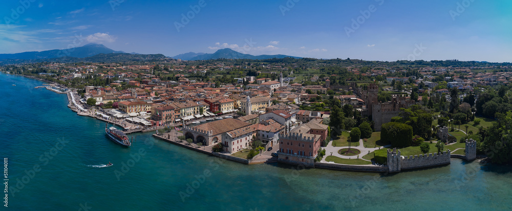 The coastline is the historical part of the city of Lazise. Aerial panorama of Lazise town on Lake Garda Italy. Aerial view of Lazise city, Verona.