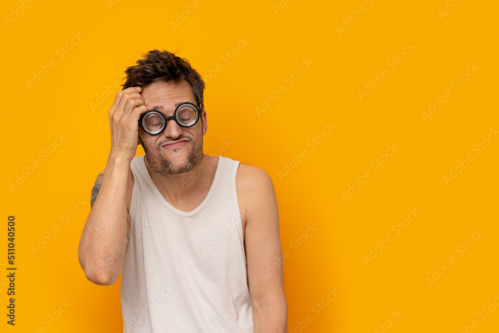 Poster Print Funny myopic man wearing thick glasses with eyes closed and a thinking expressio 40x26.7 cm