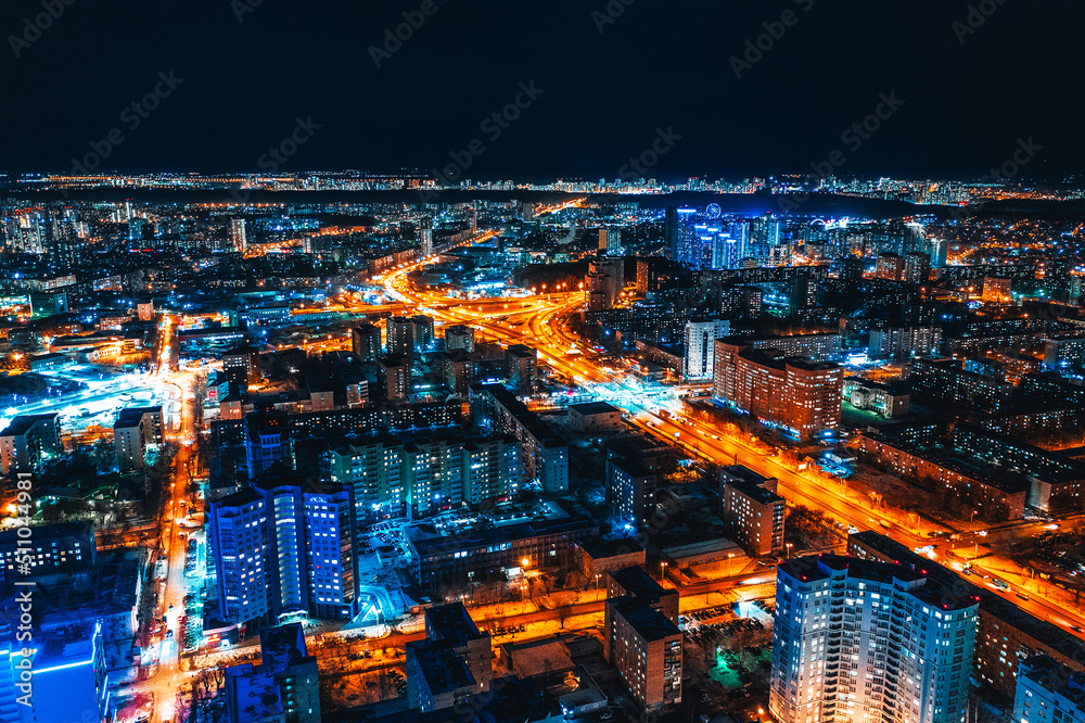 Top view of the night modern city. Bright lights of the night streets. Ekaterinburg. Russia