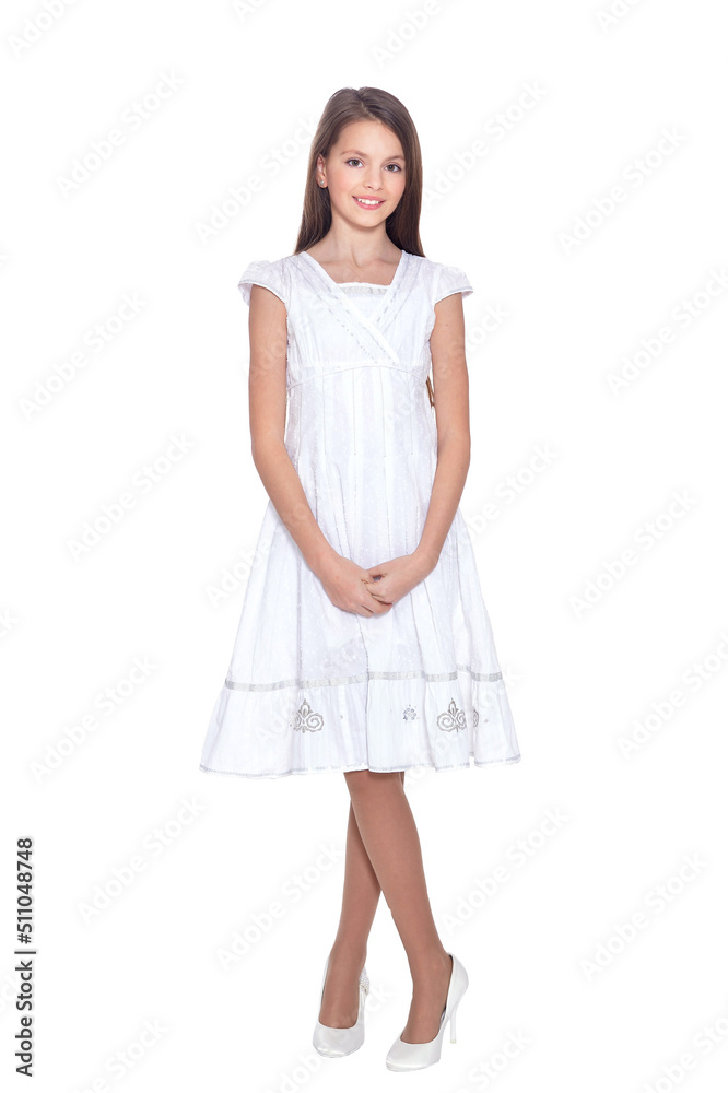 Beautiful girl in white dress posing on white background Beautiful girl in white dress posing on white background