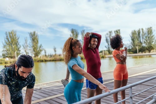 Fitness group stretching before a run outside