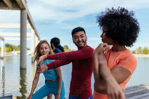 Group of multiracial people warming up outdoors