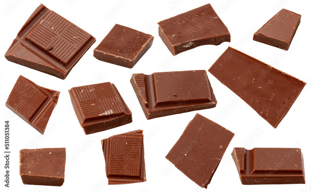 Milk chocolate. Flying pieces of milk chocolate, isolated on white background. Milk chocolate. Flying pieces of milk chocolate, isolated on white background.