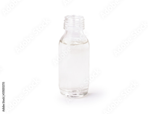 Cold pressed extra virgin coconut oil in glass bottle isolated on white background. Clipping path.