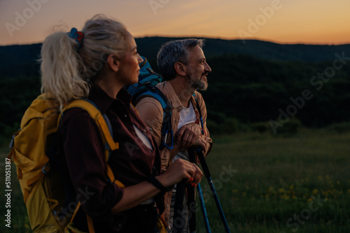 Couple with backpackers exploring nature together