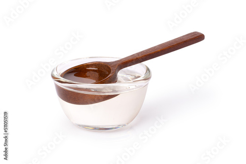 Sugar syrup in glass bowl isolated on white background with clipping path.