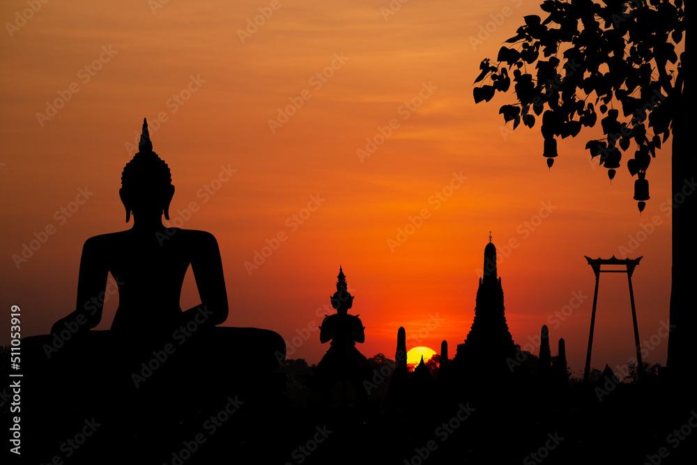 Silhouette with wat arun on sunset background.