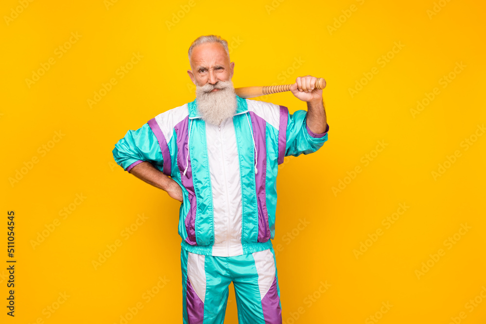 Photo of serious strict granddad sullen eyebrows hold bat wear condensed milk tin color outfit isolated on yellow background - obrazy, fototapety, plakaty 