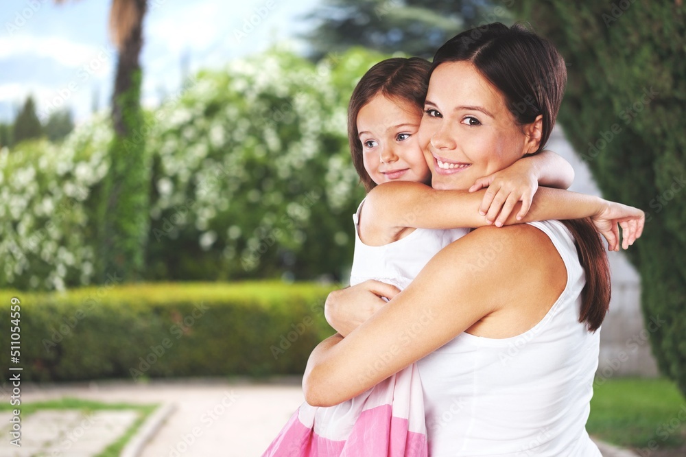 Naklejka premium Happy mother having fun with her daughter outdoor