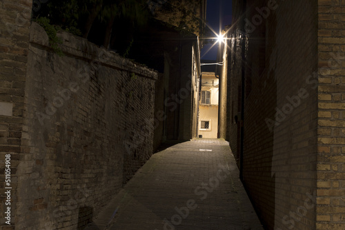 Fototapeta Naklejka Na Ścianę i Meble -  Narrow brick walkway in the city. Old Town at night. A romantic summer night at the castle