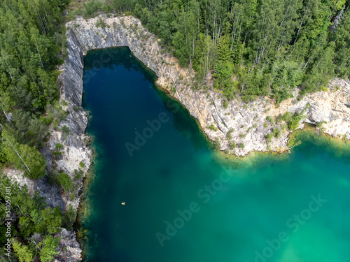 Aerial view, old limestone quarry. Drone nature photography. Turquoise water, bathing area. Travel concept.
