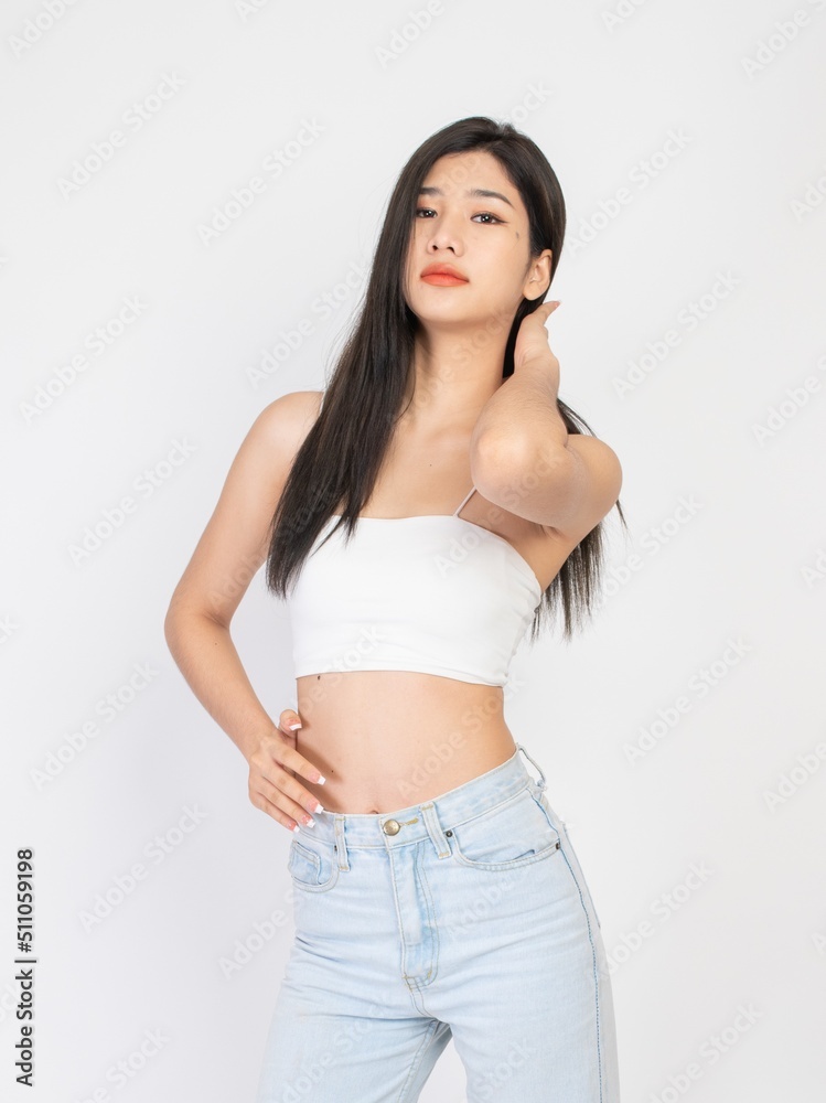 Portrait of a beautiful sexy young asian female long hair lady in white color tube top fashion, good for cosmetic and skincare or barber ads Portrait of a beautiful sexy young asian female long hair lady in white color tube top fashion, good for cosmetic and skincare or barber ads