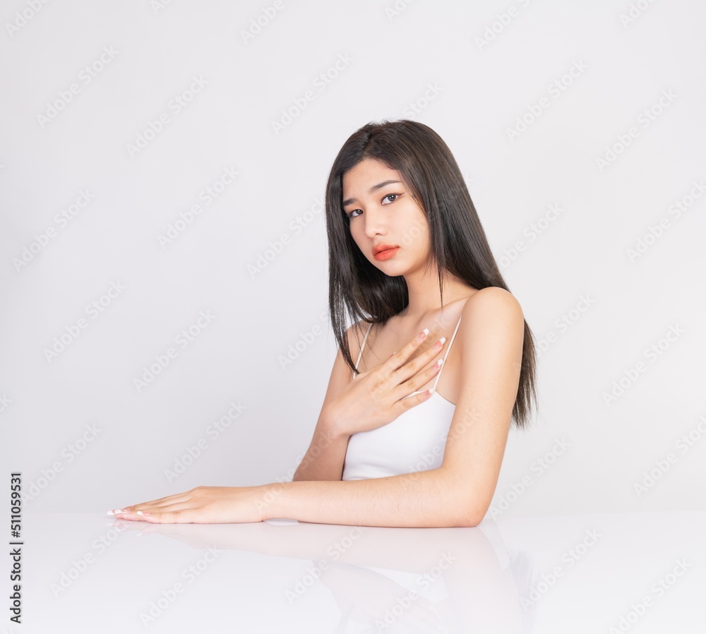 Portrait of a beautiful young asian female woman lady with clean, fresh and healthy smooth fair skin. Suitable for cosmetic, spa or massage advertisement, online social media and promotion sale usage. Portrait of a beautiful young asian female woman lady with clean, fresh and healthy smooth fair skin. Suitable for cosmetic, spa or massage advertisement, online social media and promotion sale usage.
