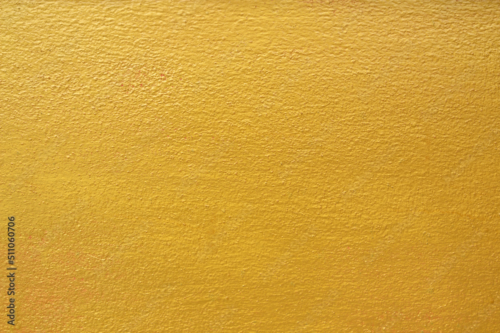 Golden cement wall texture for background work Golden cement wall texture for background work