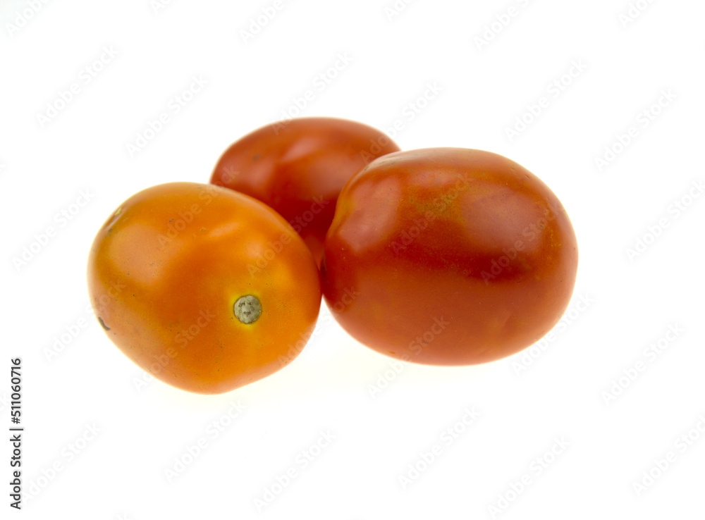 Three red tomatoes on a white background Three red tomatoes on a white background