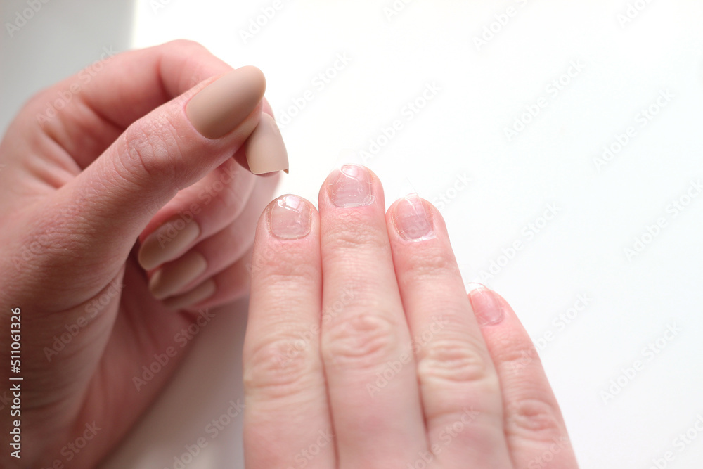 the process of gluing false beige matte long nails the process of gluing false beige matte long nails