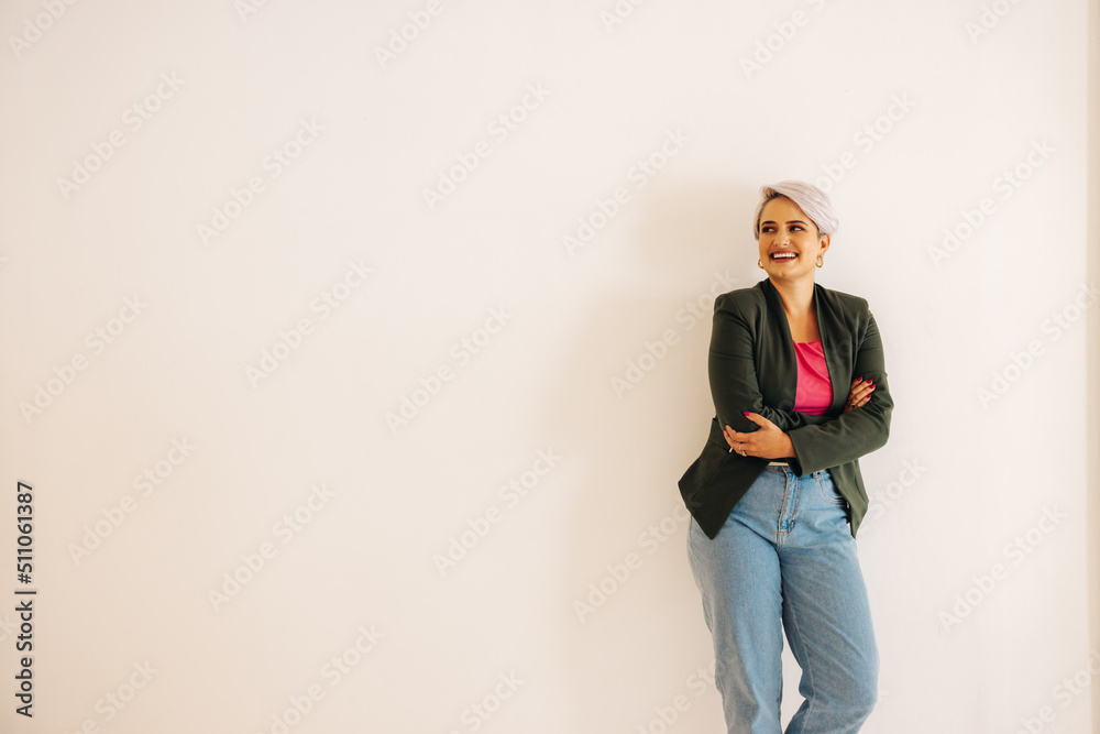 Successful businesswoman looking away with a smile Successful businesswoman looking away with a smile