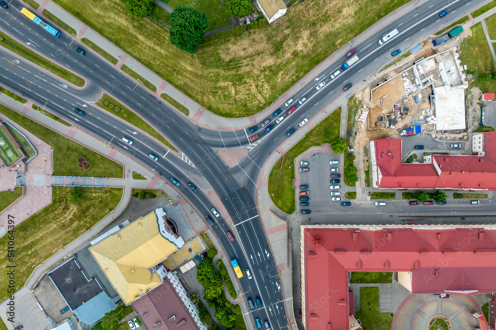 aerial view of road junction with heavy traffic at city