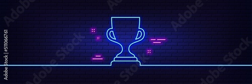 Neon light glow effect. Award cup line icon. Winner Trophy symbol. Sports achievement sign. 3d line neon glow icon. Brick wall banner. Award cup outline. Vector