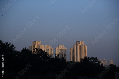 city skyline in sunset. selective focus" "shallow depth of field" or "blur"