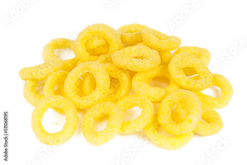 Yellow cereal rings on a white background, beer snack.