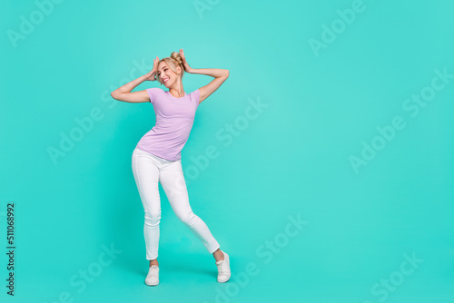 Full length body size view of attractive cheerful girly girl dancing rest chill isolated over teal turquoise color background © deagreez