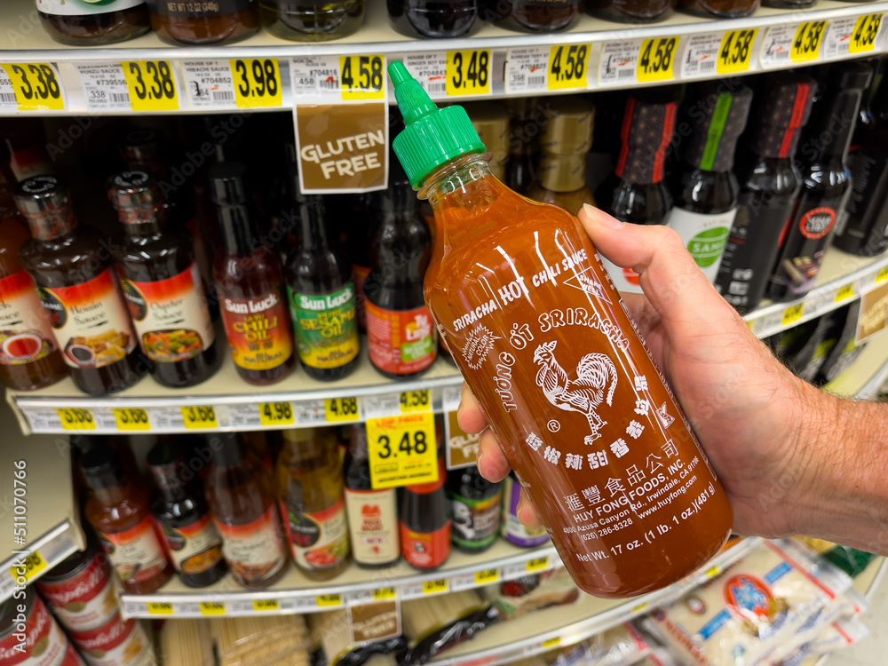 ATLANTA, June 16, 2022 Person holding Sriracha hot chili